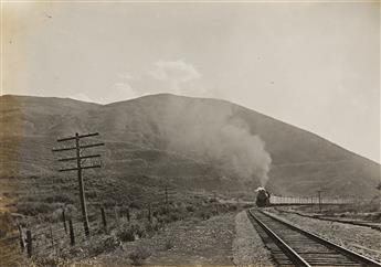 (RAILROAD CONSTRUCTION--UNION PACIFIC) An album with approximately 92 photographs documenting railway construction, trains, and the wor